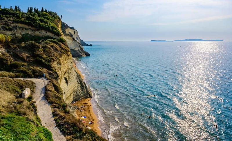 Corfu: Palaiokastritsa Swimming and Loggas Beach Sunset Tour - The Holy Theotokos Monastery above the bay