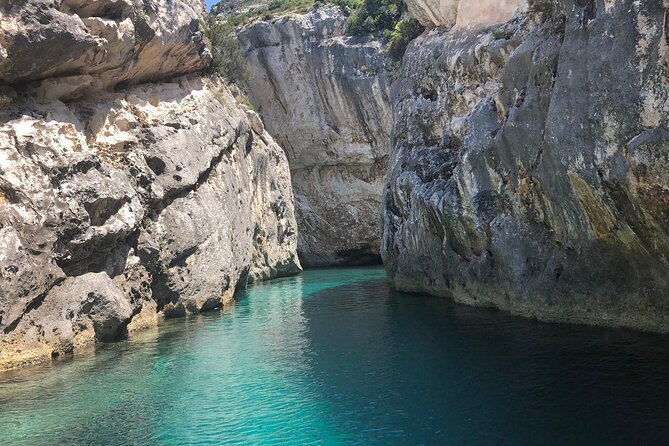 Secret Blue Gem Cave & Grama Bay Boat Tours Vlore - Entering the Blue Cave near Llovizi