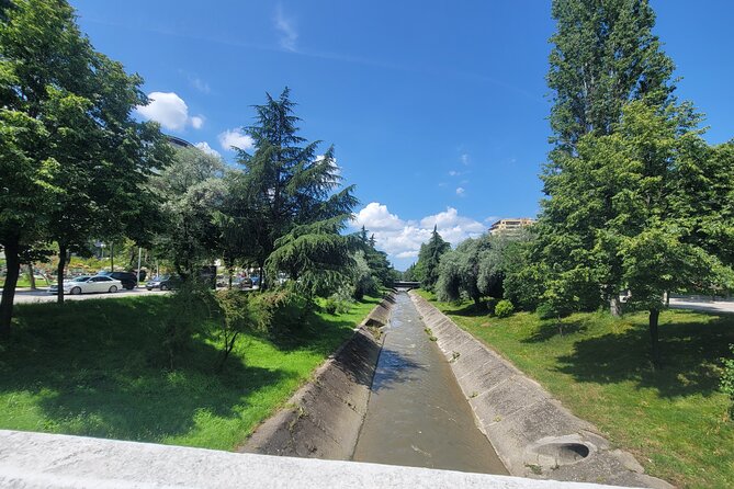 Tirana’s Communist Past: A Tasting Tour with Traditional Lunch - Postbllok, prison columns, and a fragment of the Berlin Wall